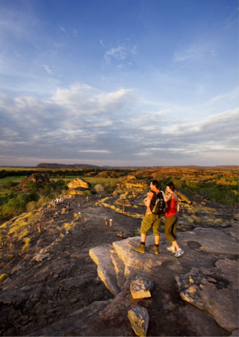 Photograph showing vistirs watching the sunset from the Ubirr escarpment/lookout