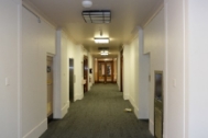A corridor with a glazed doorway.