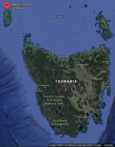 Satellite Map showing the State of Tasmania and King Island to north-west. Red location marker identifies Cape Wickham Lighthouse on northern end of King Island.  

