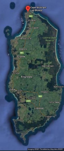 Satellite Map showing King Island. Red location marker identifies location of Cape Wickham Lighthouse on northern coast. Other location names are dotted around the map.

