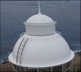 Photograph showing a white dome roof with curved ladder attached to roof.