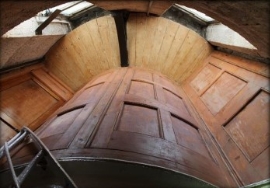 Photograph showing curved timber panels.