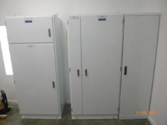 Photograph showing white cabinets.