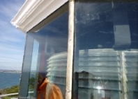 Photograph showing close up of clear lantern room glazing panes. 