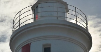 Photograph showing underside of curved lighthouse balcony. 