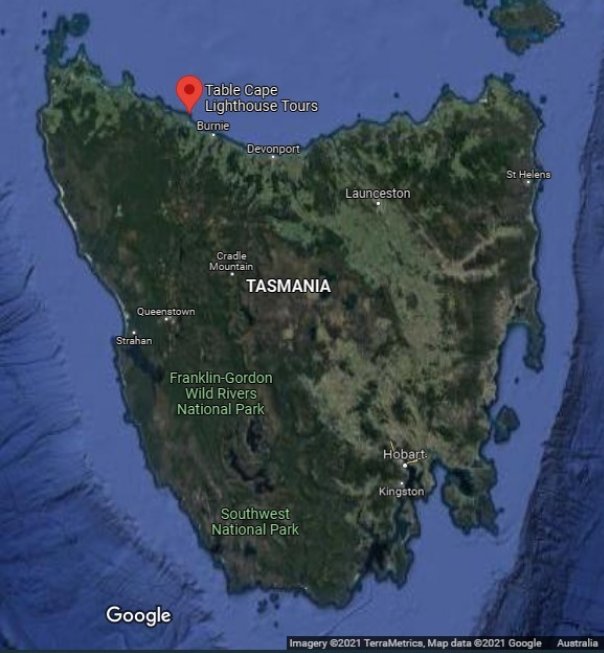 Map showing satellite image of Tasmania. A red marker located on the north coast highlights the position of Table Cape Lighthouse.