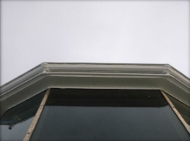 Photograph showing gutter of lantern room roof. Glazing panes fitted underneath.