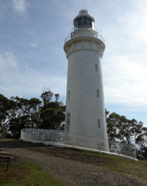 Photograph showing Table Cape Lighthouse - a white lighthouse against blue sky. 