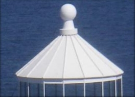 Photograph showing a white pyramidal roof.