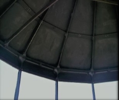 Photograph showing underside of pyramidal roof with exposed cast metal ribs.