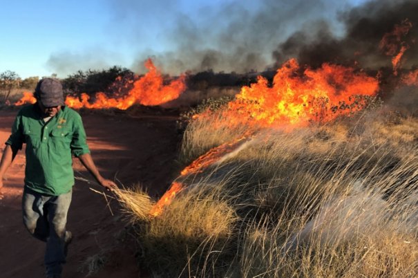 Photo: Zecharia Spencer conducting traditional burning on the Kiwirrkurra IPA 