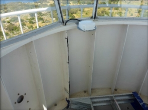 Photograph showing GRP panels bolted together to form round lantern house. 