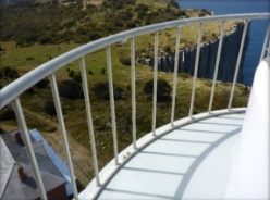 Photograph showing curved balcony balustrade fitted to outer edge of balcony floor. 