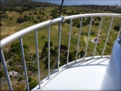 Photograph showing curved balcony balustrade fitted to outer edge of balcony floor. 