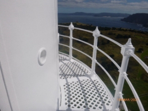 Photograph showing curved lattice balcony with balustrades fitted to outer edge of floor. 