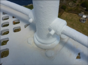 Photograph showing balustrade base bolted to lattice balcony floor. 