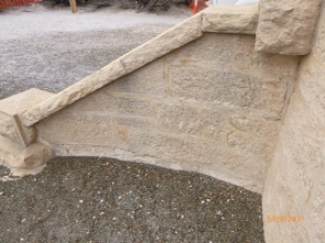 Photograph showing sandstone stringer of entrance steps at base of lighthouse.