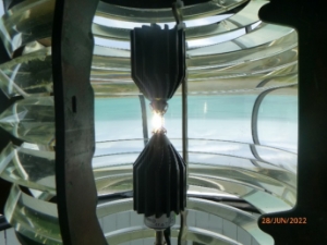 Photograph showing LED lighthouse fitted inside prismatic lens. 