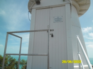 Photograph showing double front doors of lighthouse tower. 