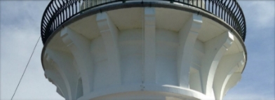 Photograph showing underside of lighthouse balcony which is supported by stone brackets.