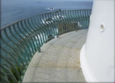 Photograph showing curved granite balcony floor with gunmetal railing fitted to outer edge. 